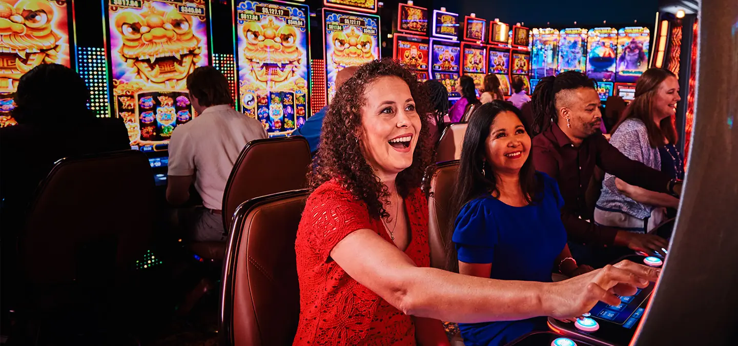 Friends winning at casino games.